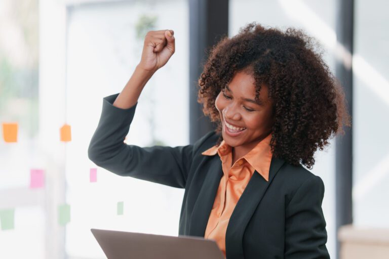 A businesswoman celebrates social media results