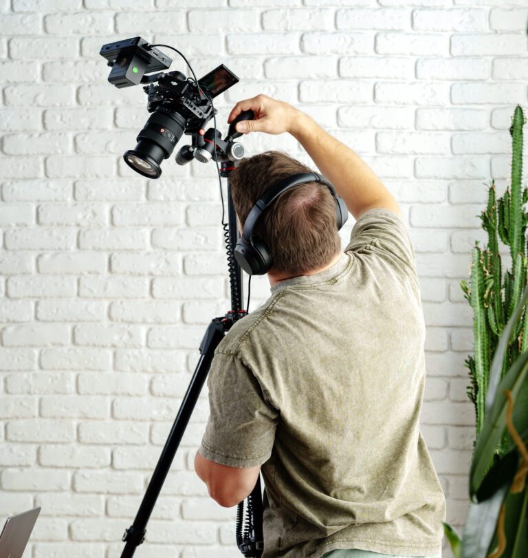 A videographer prepares for a video shoot.