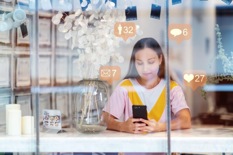 A business owner receives the benefit of regular posting with a Cdesigns Marketing social media package